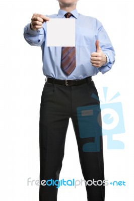 Businessman Showing  Thumb Up And Holding Or Presenting A Blank Stock Photo