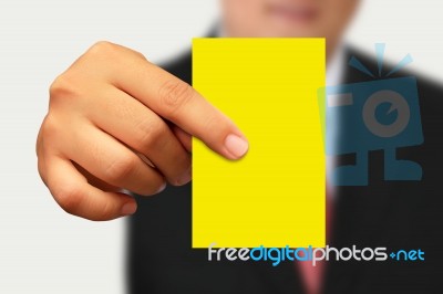 Businessman Showing Yellow Paper Stock Photo