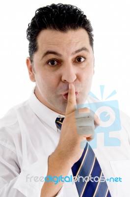 Businessman Shushing With First Finger Stock Photo