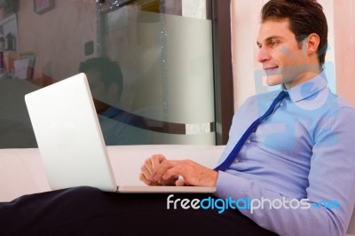 Businessman Sitting Couch Using Laptop Stock Photo