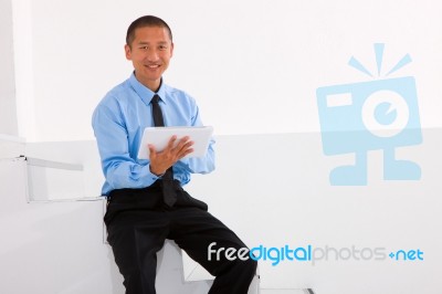 Businessman Sitting Stairs Holding Digital Tablet Stock Photo