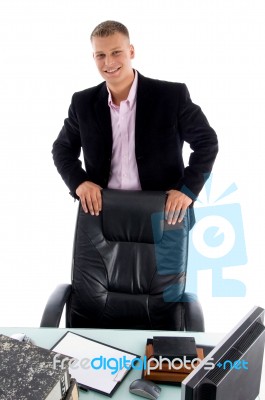 Businessman standing at his desk Stock Photo