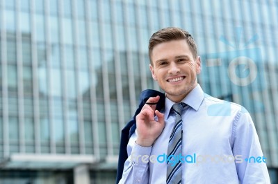 Businessman Standing Outside Modern Building Stock Photo