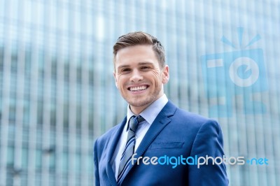 Businessman Standing Outside Modern Building Stock Photo