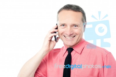 Businessman Talking On A Mobile Phone Stock Photo