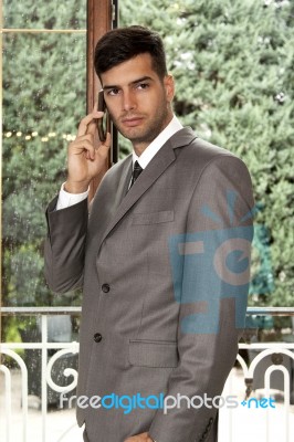 Businessman Talking On Mobile Phone Stock Photo