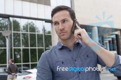 Businessman Talking On The Phone Stock Photo