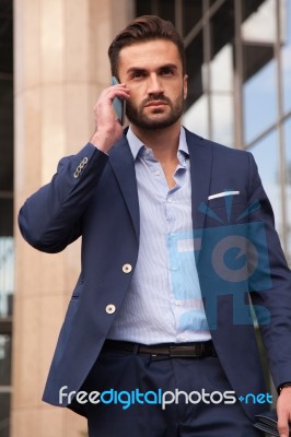 Businessman Talking On The Phone Stock Photo