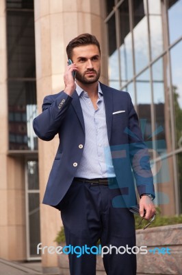 Businessman Talking On The Phone Stock Photo