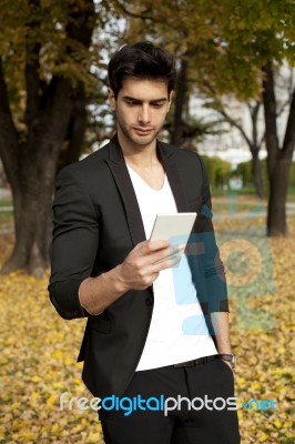 Businessman Texting On Mobilephone Stock Photo