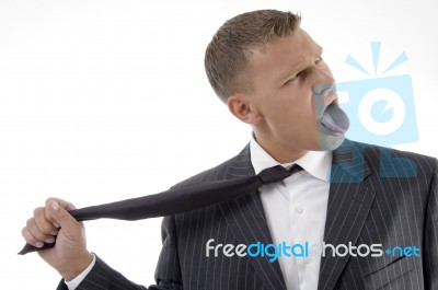 Businessman Tightening His Tie Stock Photo