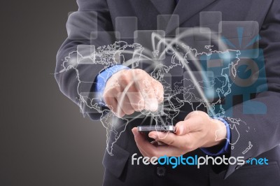 Businessman Touching Network Around The World Stock Photo