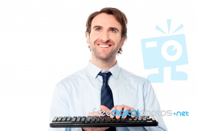 Businessman Typing On Keyboard Stock Photo