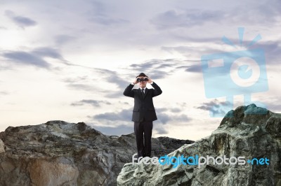 Businessman Using Binoculars Stock Photo