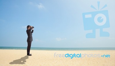 Businessman Using Binoculars Stock Photo