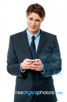 Businessman Using Mobile Phone Stock Photo