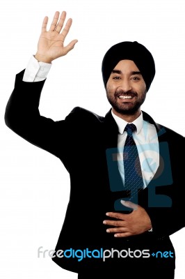 Businessman Waving Hi To His Colleague Stock Photo