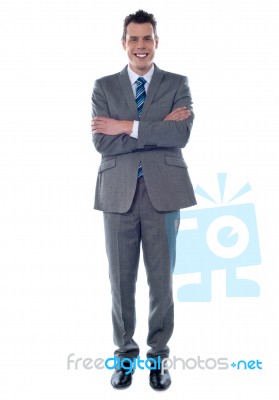 Businessman With Arms Crossed Stock Photo