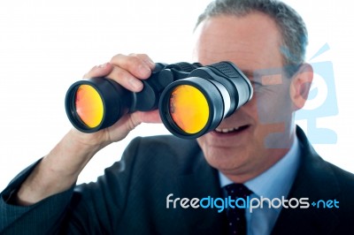 Businessman with Binoculars Stock Photo