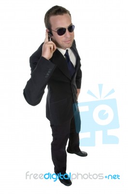 Businessman With Bluetooth And Sunglasses Stock Photo