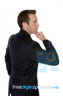 Businessman With Chin Resting On Hand Stock Photo