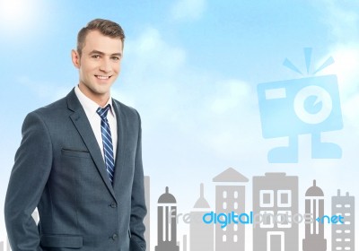 Businessman With City Skyline Background Stock Photo