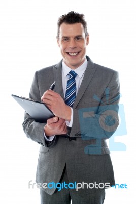 Businessman With Clipboard Stock Photo