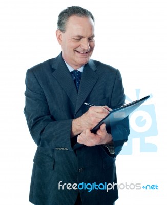 Businessman with clipboard Stock Photo