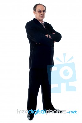 Businessman With Crossed Arms Stock Photo