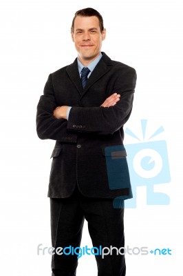 Businessman With Crossed Arms Stock Photo