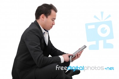 Businessman With Digital Pad Touch Screen Sitting In Yoga Lotus Stock Photo