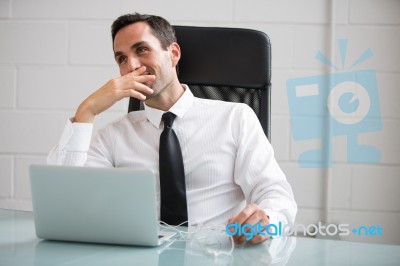 Businessman With Earphones Stock Photo