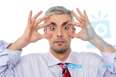 Businessman With Eyes Wide Open Stock Photo