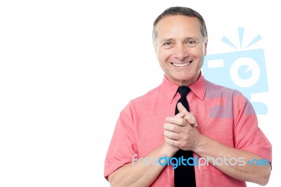 Businessman With Hands Clasped Stock Photo