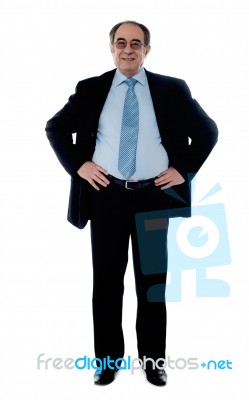 Businessman With Hands On Waist Stock Photo