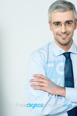 Businessman With His Arms Crossed Stock Photo