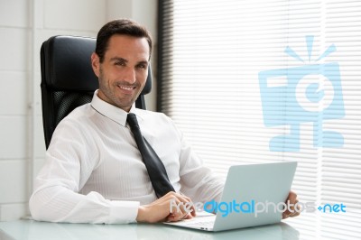 Businessman With Laptop Stock Photo