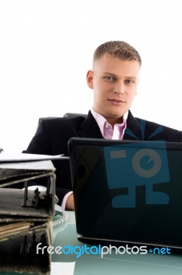 Businessman With Laptop And Files Stock Photo