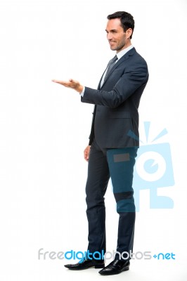 Businessman With Lifted Arm Stock Photo