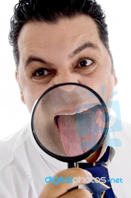 Businessman With Magnified Tongue Stock Photo