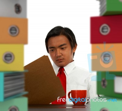 Businessman With Stacked Files Stock Photo