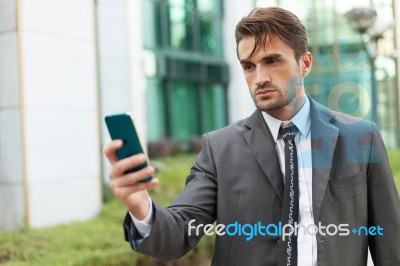 Businessman With The Smart Phone Stock Photo