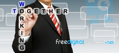 Businessman With Wording Working Together Stock Photo