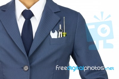 Businessman With Wrench And Compass And Screwdriver In Pocket Stock Photo