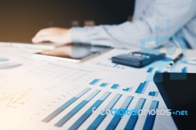 Businessman Working With Calculator At The Office And Financial Stock Photo