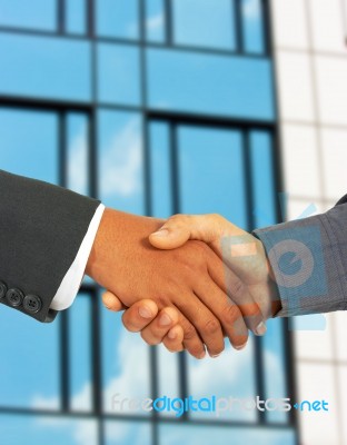 Businessmen Greet Each Other By Shaking Hands Stock Photo