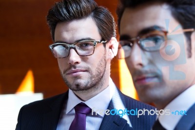 Businessmen  In Modern Office Stock Photo