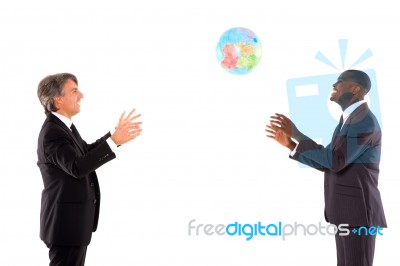 Businessmen Playing With Globe Stock Photo