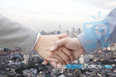 Businessmen Shaking Hands Stock Photo