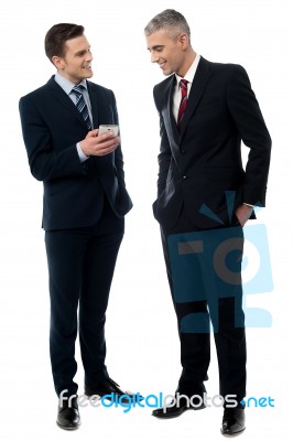 Businessmen Using Mobile Phone Stock Photo